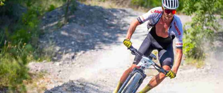 Dynamic shot of a man mountain biking on a dirt trail in Tulcea, Romania., tags: la resistenza - pexel